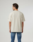 Men's premium heavyweight oversized t-shirt in beige with embroidered detailing, back view
