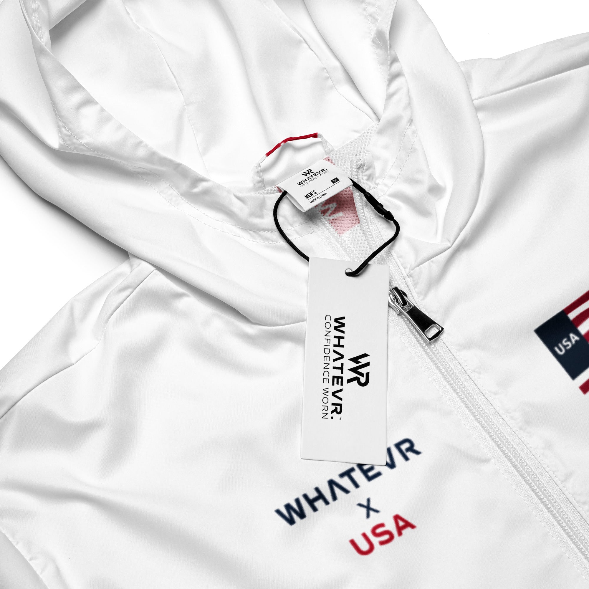 White jacket with 'Whatevr x USA' branding and a tag on a white background