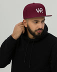 Unisex Signature snapback hat in burgundy with embroidered WR logo, front view