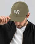 Unisex Signature trucker hat in green with embroidered WR logo, front view