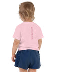 Toddler girl's t-shirt in pink with "WHATEVR" text, back view.