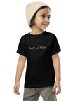Toddler t-shirt in black with "Nap Later" text, front view.