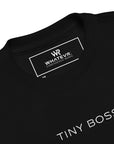 Toddler t-shirt in black with "Tiny Boss" text, front view.