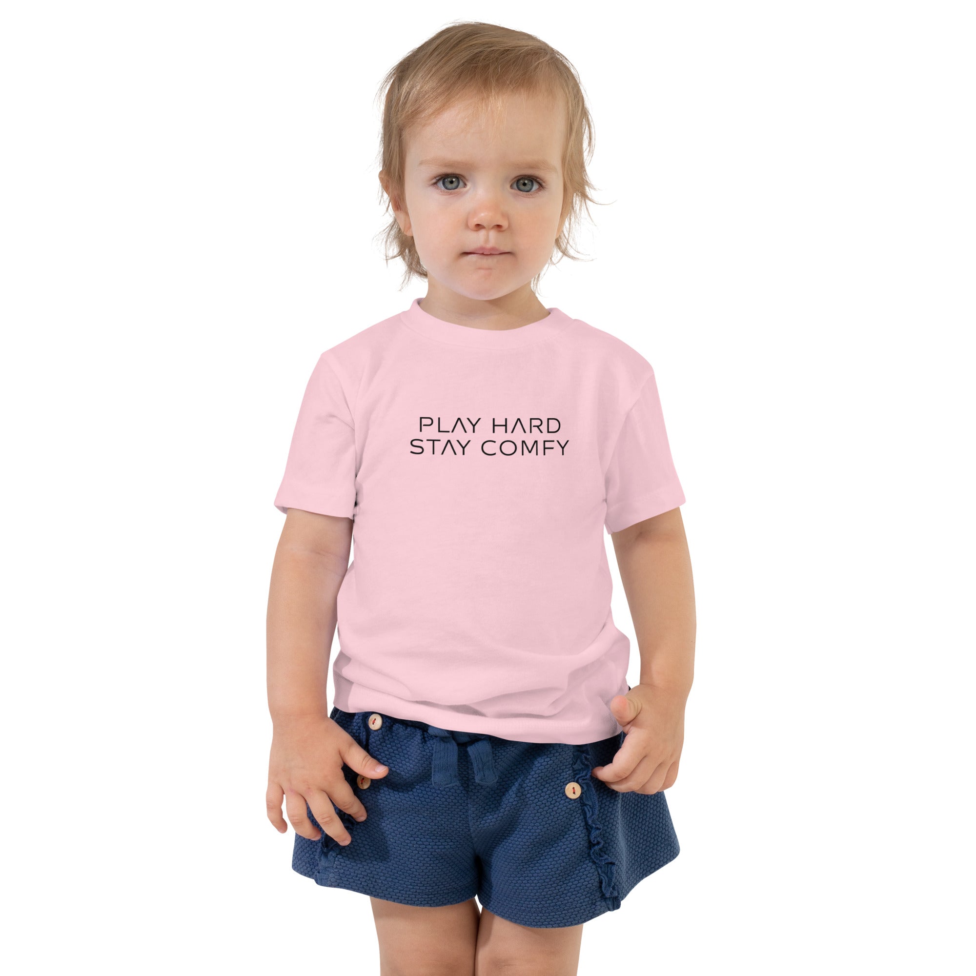 Toddler t-shirt in pink with "Play Hard Stay Comfy" text, front view.