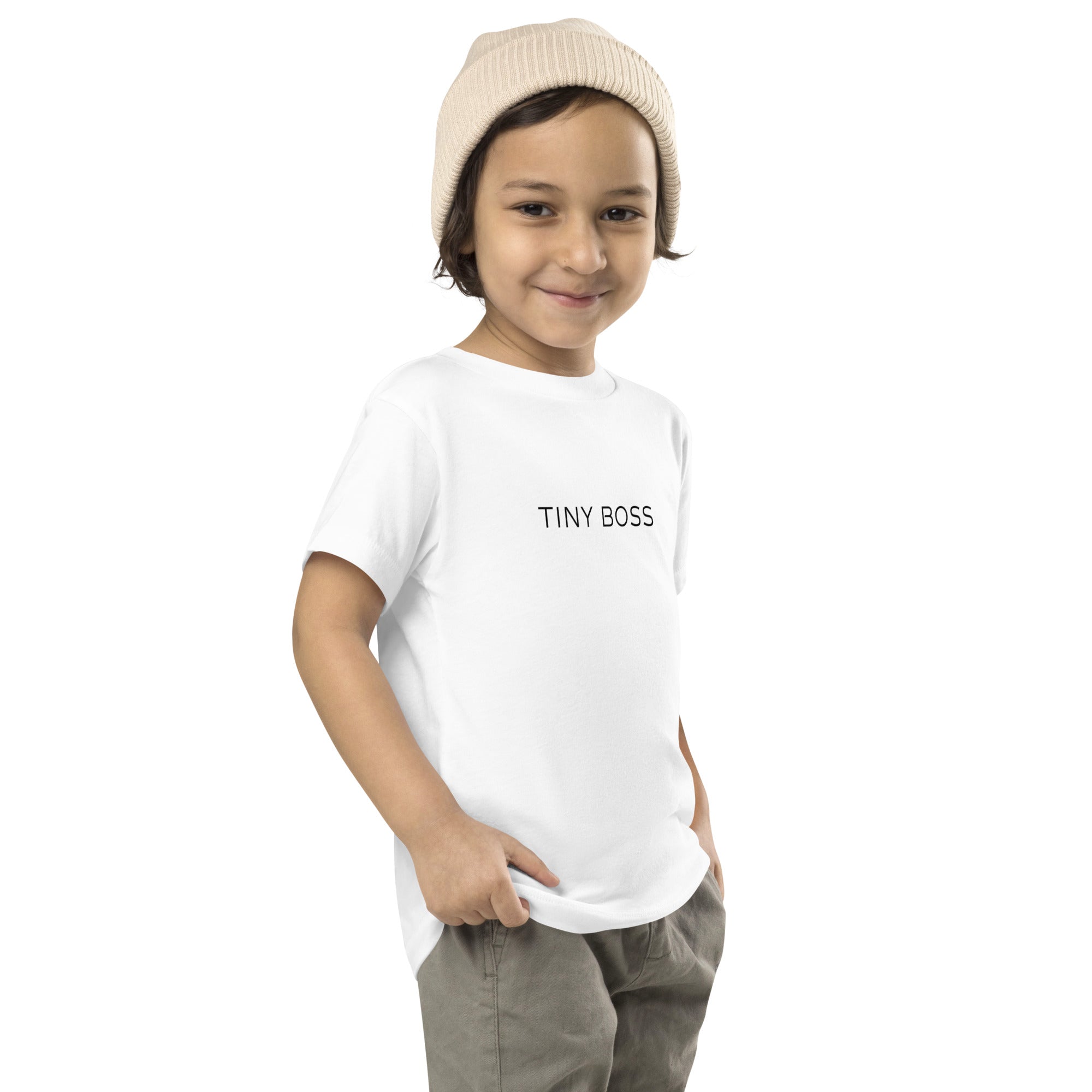 Toddler t-shirt in white with "Tiny Boss" text, front view.
