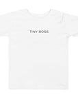 Toddler t-shirt in white with "Tiny Boss" text, front view.
