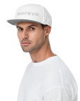 Unisex Tonal snapback hat in white with embroidered WHATEVR text, front view