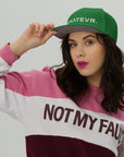 Unisex Unbothered snapback hat in green with embroidered WHATEVR text, front view