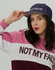 Unisex Unbothered snapback hat in blue with embroidered WHATEVR text, front view