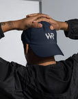 Unisex Classic baseball cap in blue with embroidered WHATEVR logo, front view