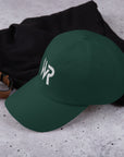 Unisex Classic baseball cap in green with embroidered WHATEVR logo, side view