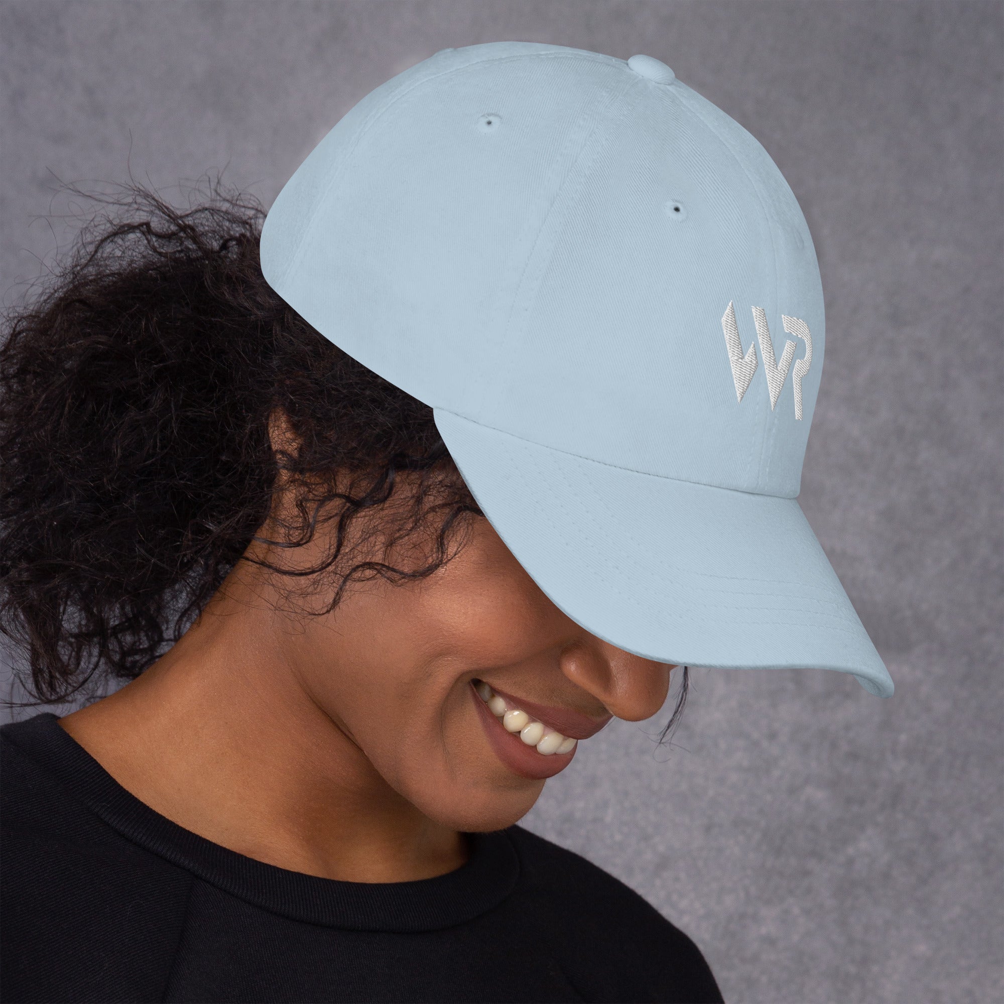 Unisex Classic baseball cap in light blue with embroidered WHATEVR logo, front view