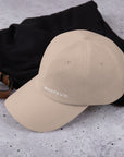 Unisex Classic baseball cap in beige with WHATEVR logo, side view