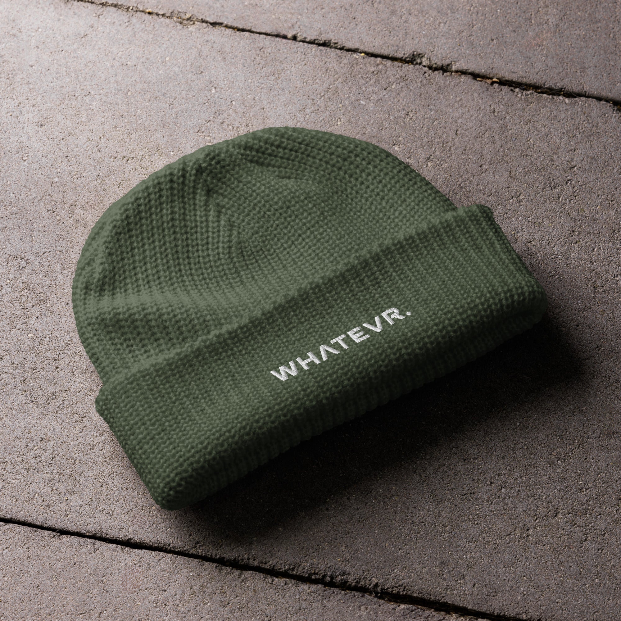 Unisex WHATEVR beanie in green with embroidered detailing, front view