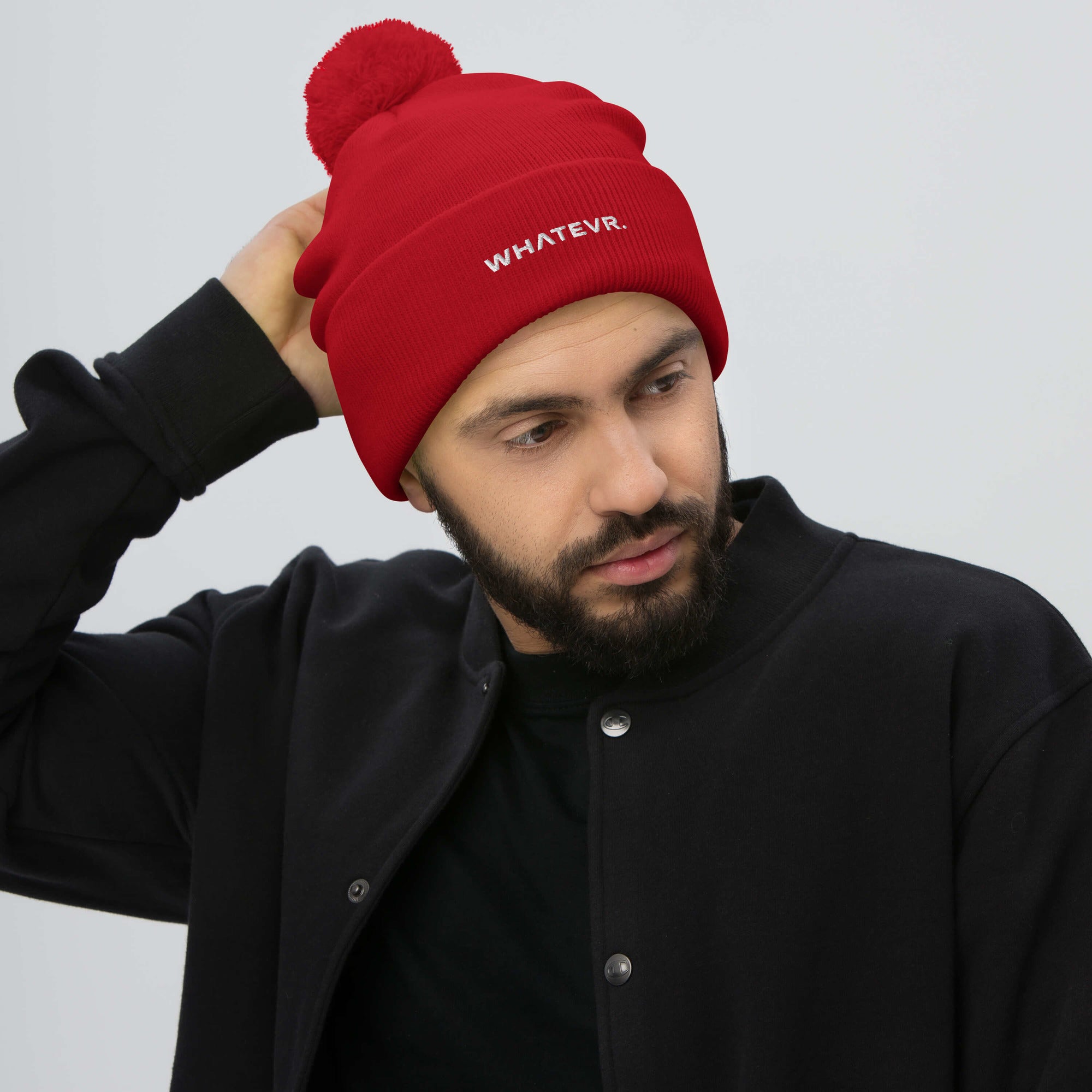 Unisex Signature pom pom knit beanie in red with embroidered WHATEVR text, front view