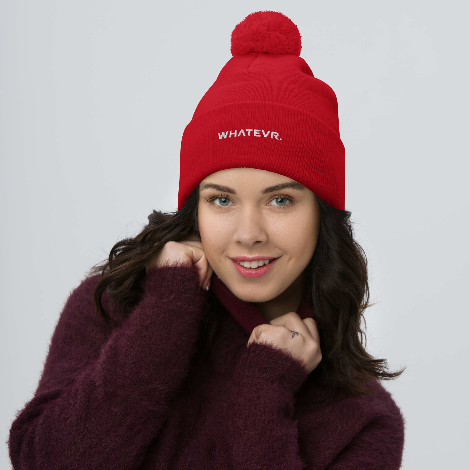 Unisex Signature pom pom knit beanie in red with embroidered WHATEVR text, front view