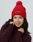Unisex Signature pom pom knit beanie in red with embroidered WHATEVR text, front view