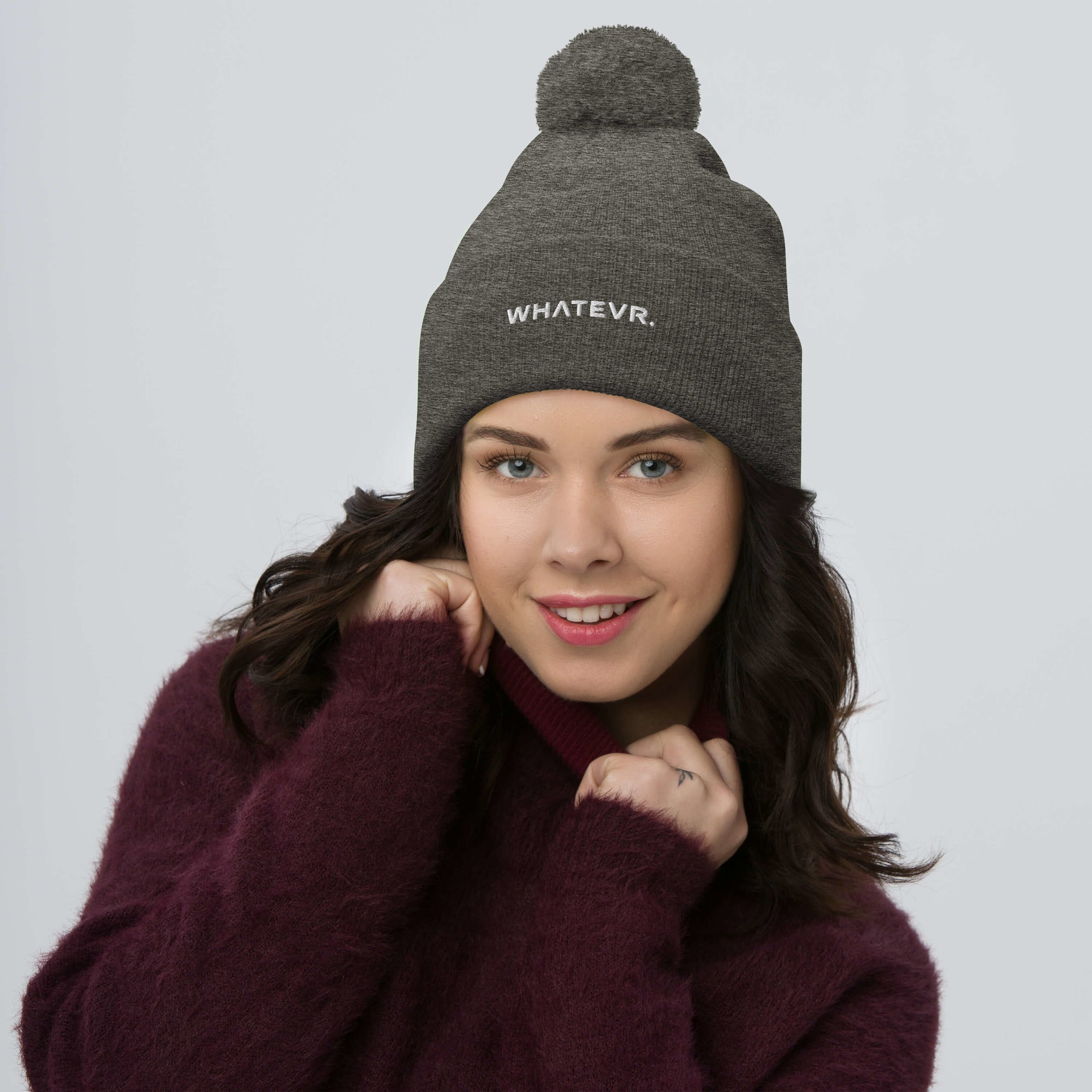 Unisex Signature pom pom knit beanie in gray with embroidered WHATEVR text, front view
