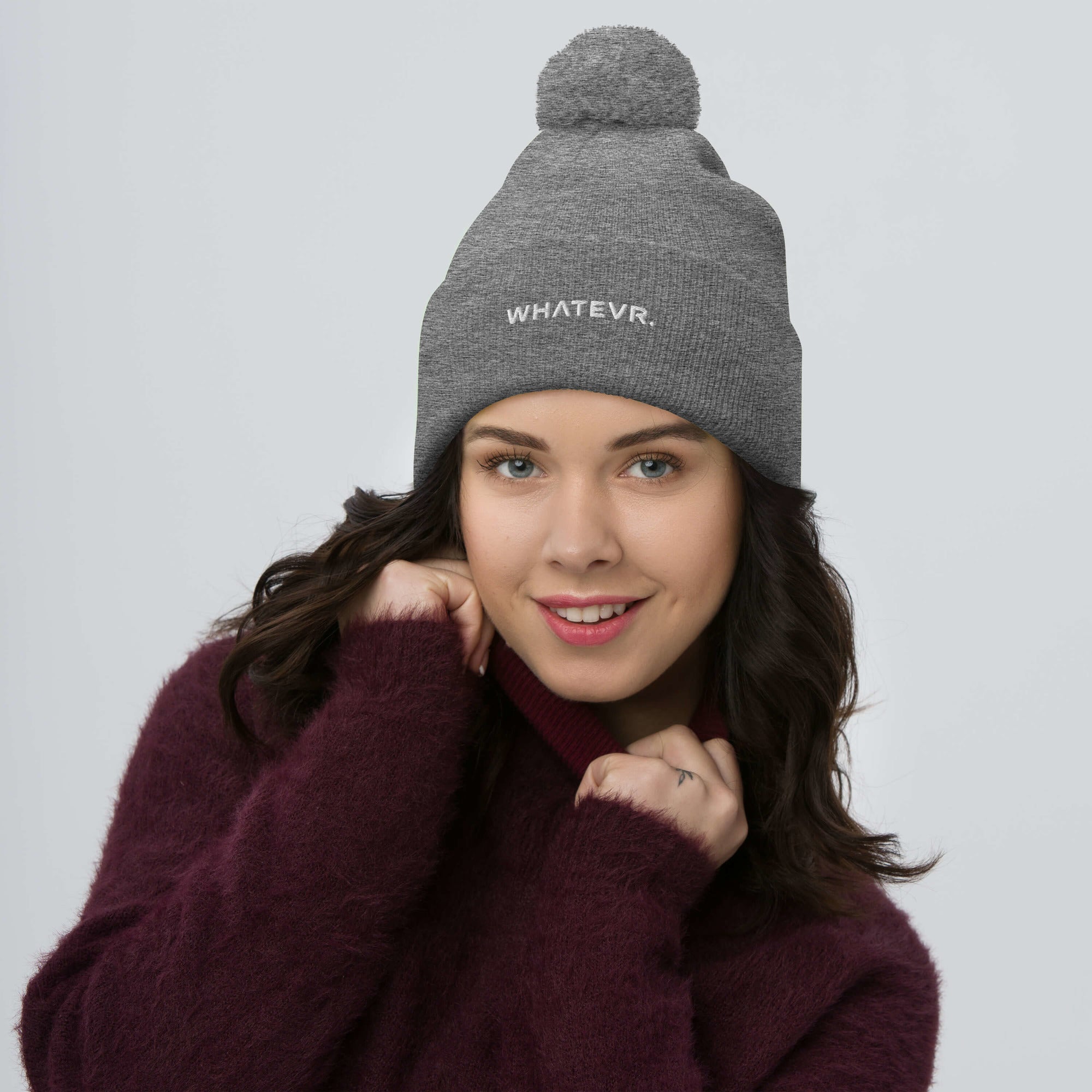 Unisex Signature pom pom knit beanie in gray with embroidered WHATEVR text, front view