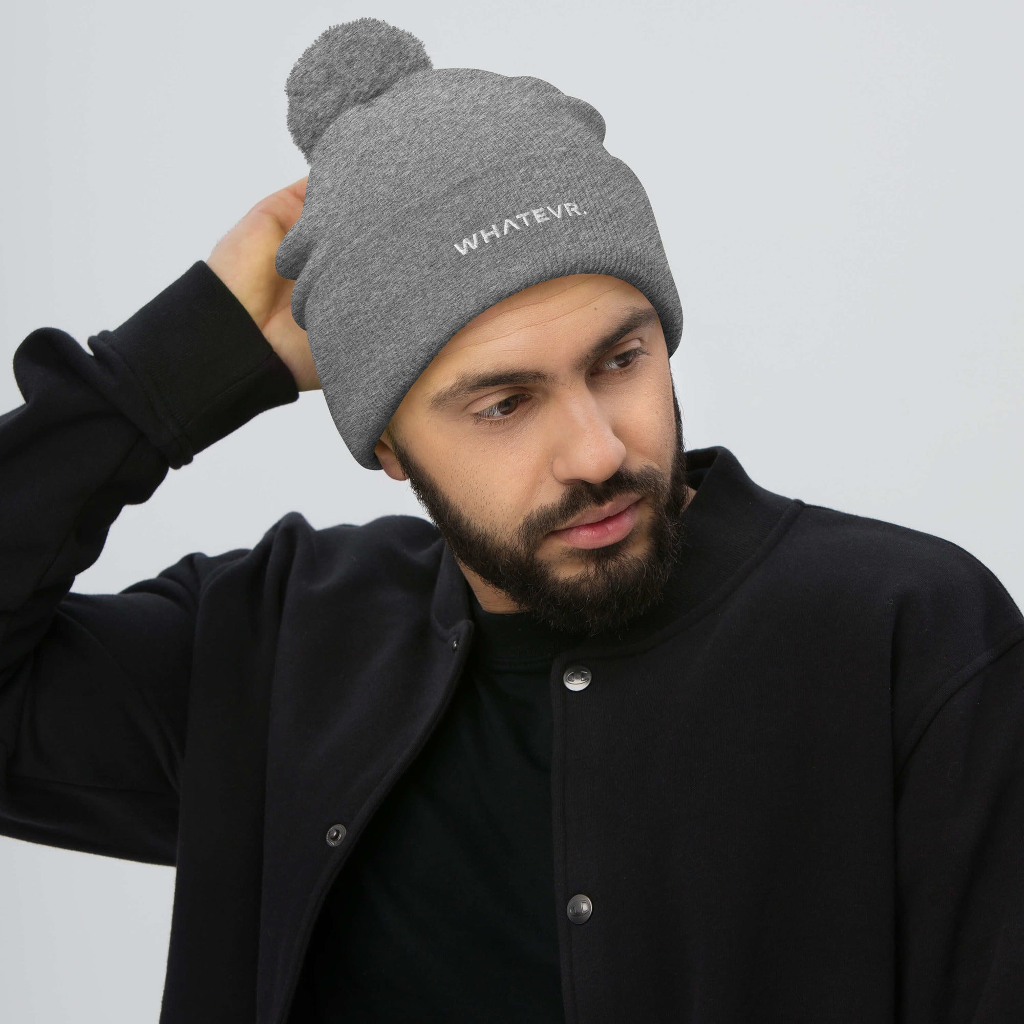 Unisex Signature pom pom knit beanie in gray with embroidered WHATEVR text, front view