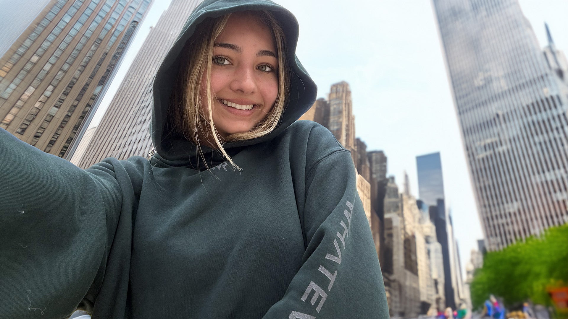 Person wearing a WHATEVR hoodie