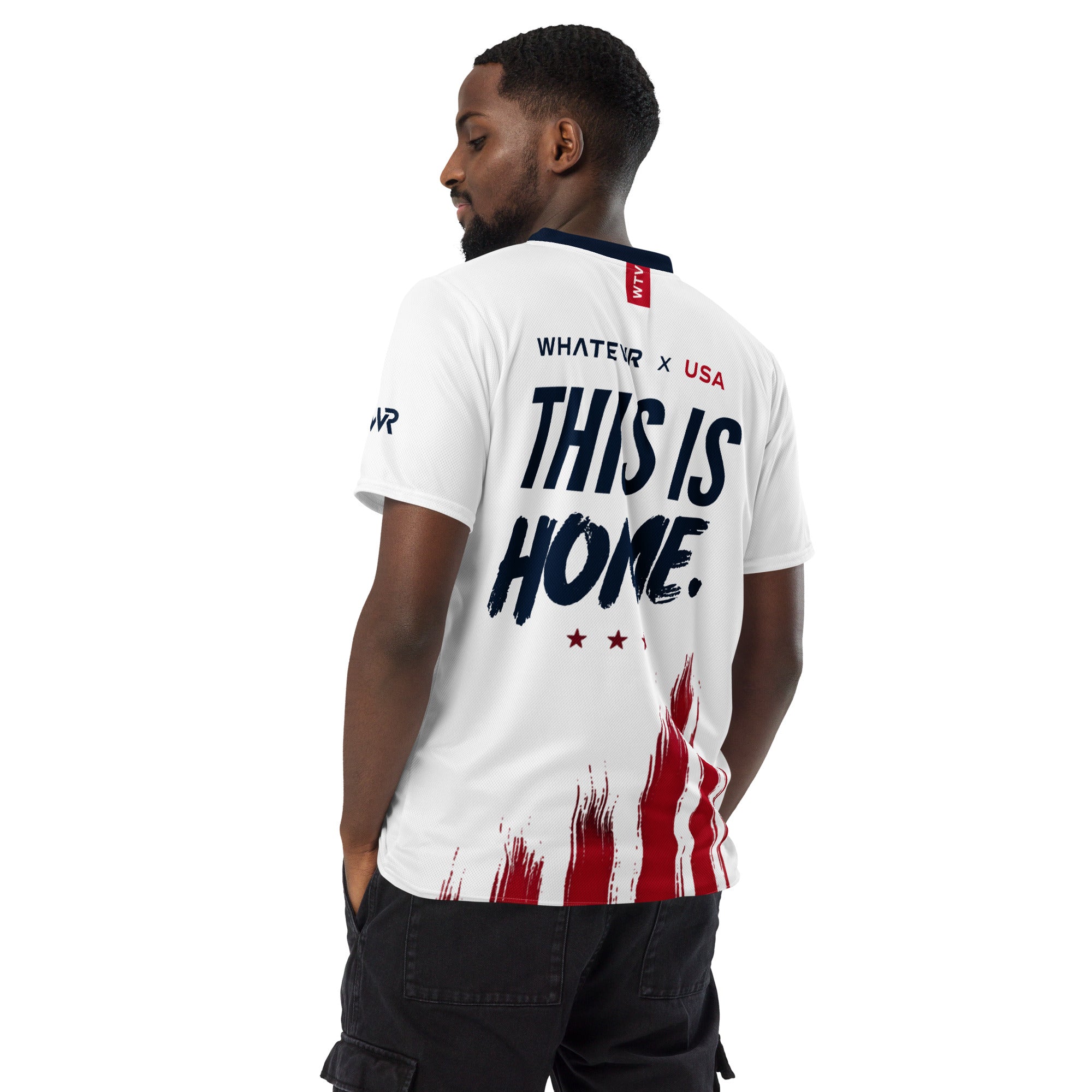 Man wearing a white t-shirt with 'THIS IS HOME' text and American flag design on a white background