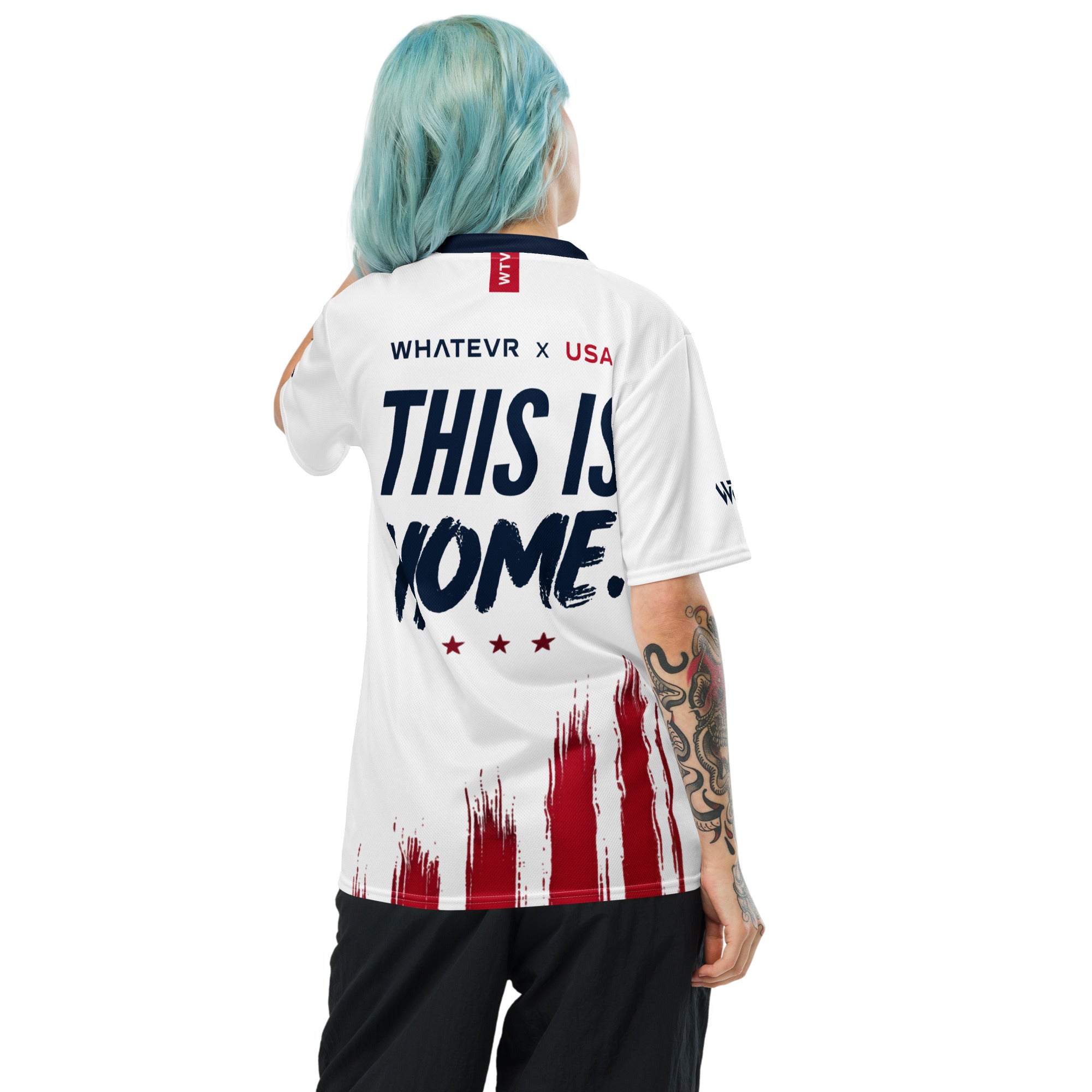 Person wearing a white sports jersey with text and red and blue design on a white background