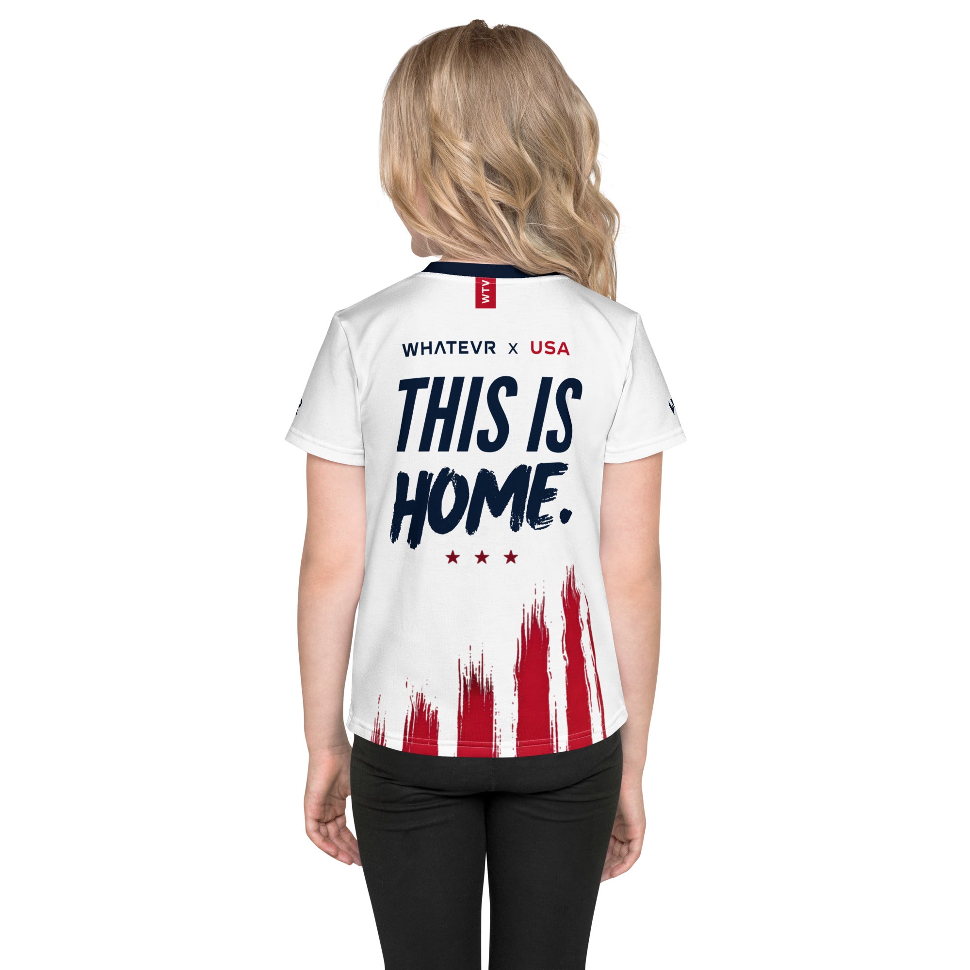 Person wearing a white sports jersey with 'This is Home' text and American flag design on a white background