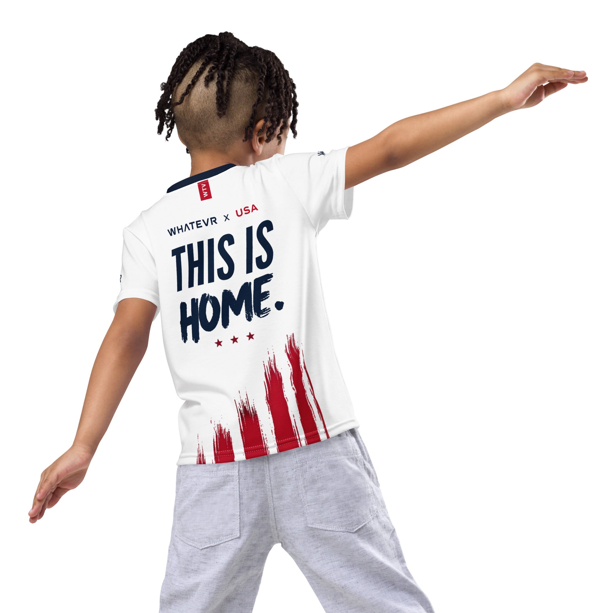 Person wearing a white t-shirt with 'This is Home' text and an American flag design on a white background