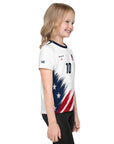 Child wearing a sports jersey with American flag design on a white background