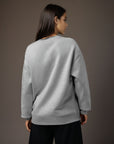 Women's premium sweatshirt in light gray, back view.