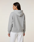 Women's premium heavyweight hoodie in ash heather, back view.