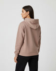 Women's premium heavyweight hoodie in taupe, back view.