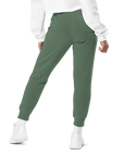 Women's essential relaxed sweatpants in green, back view.