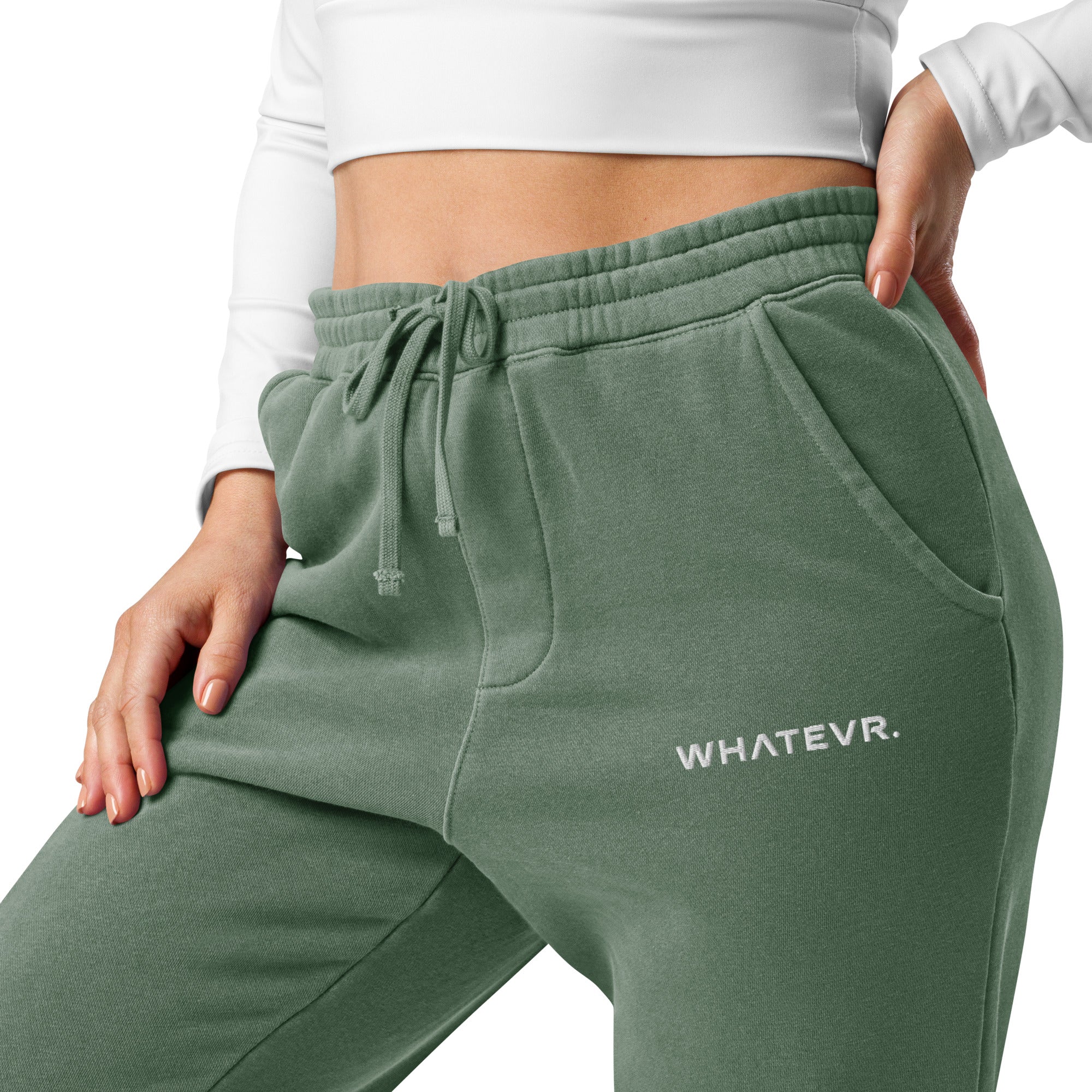Women's essential relaxed sweatpants in green with embroidered detailing, front view.
