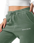 Women's essential relaxed sweatpants in green with embroidered detailing, front view.