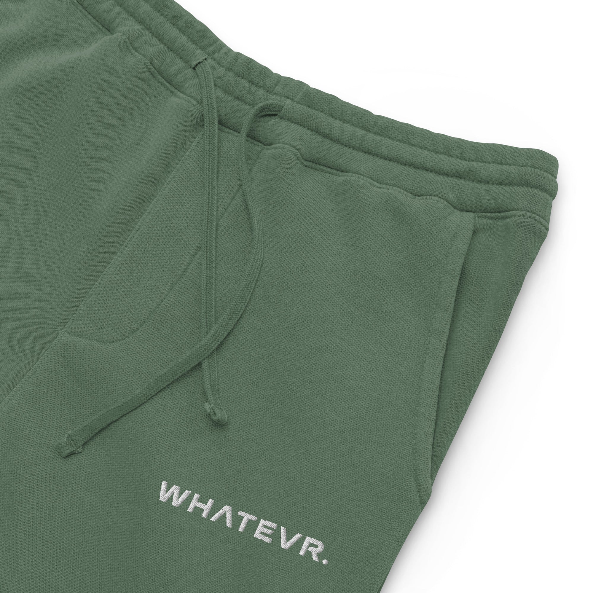 Women's essential relaxed sweatpants in green with embroidered detailing, front view.