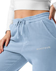 Women's essential relaxed sweatpants in light blue with embroidered detailing, front view.