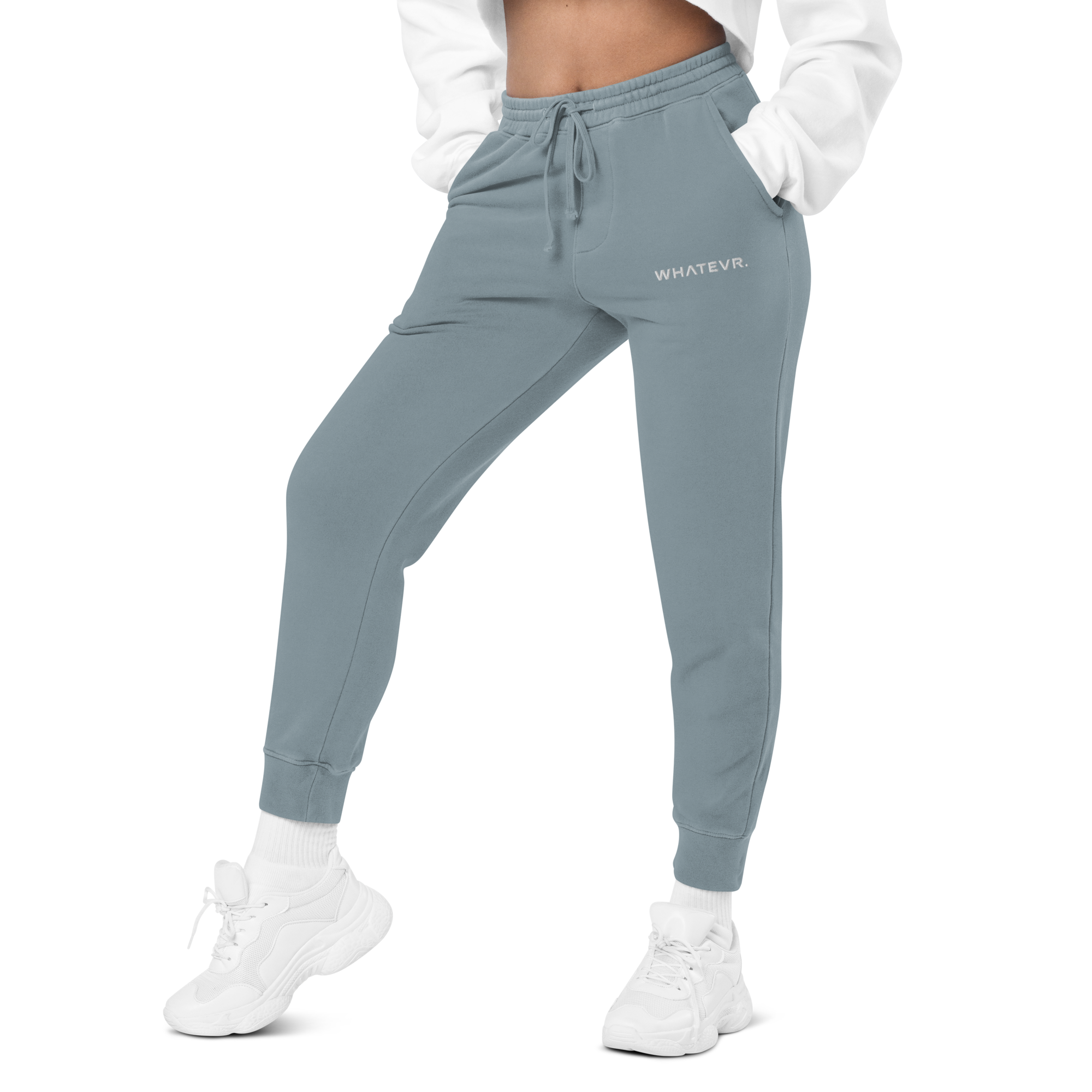 Women's essential relaxed sweatpants in light blue with embroidered detailing, front view.