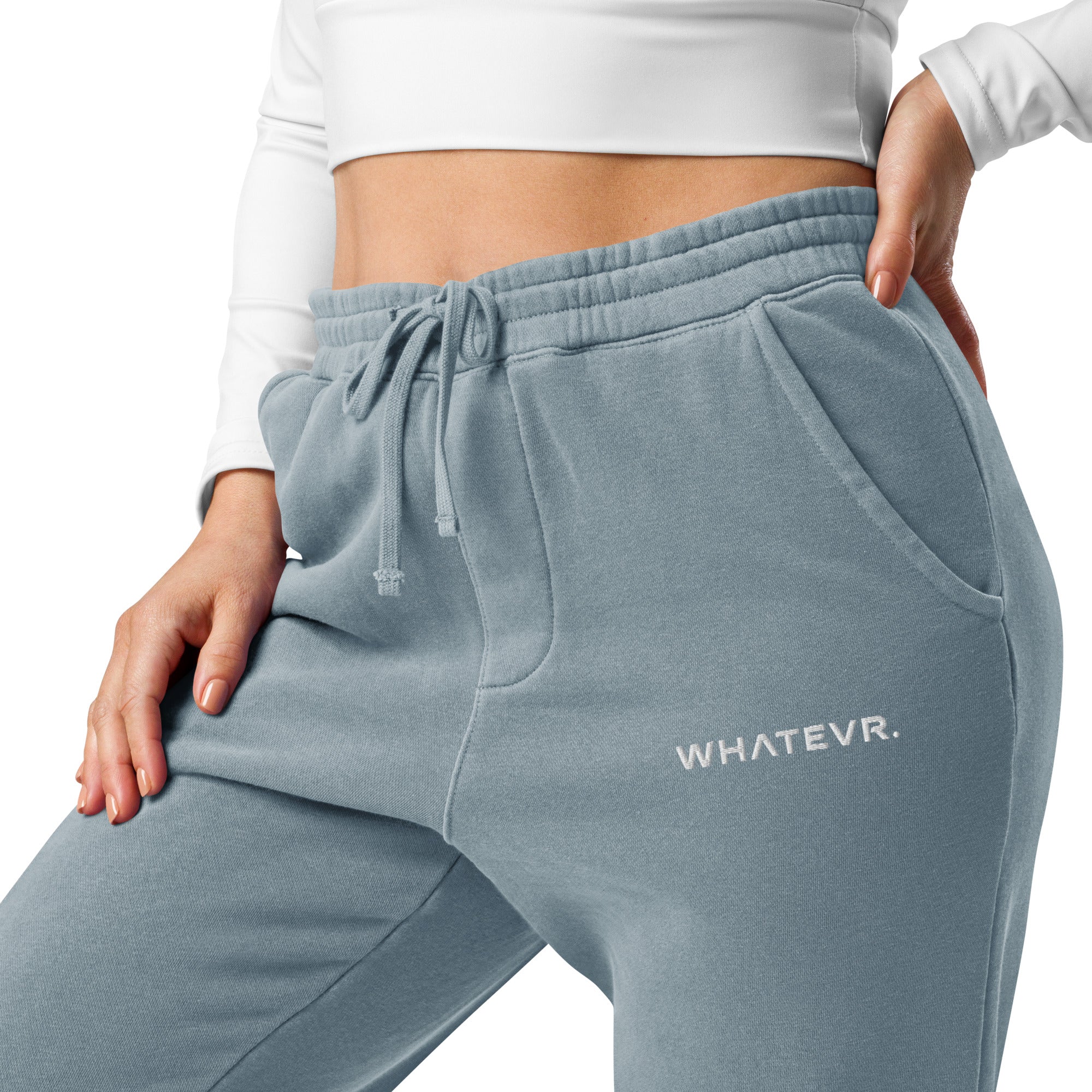 Women's essential relaxed sweatpants in light blue with embroidered detailing, front view.