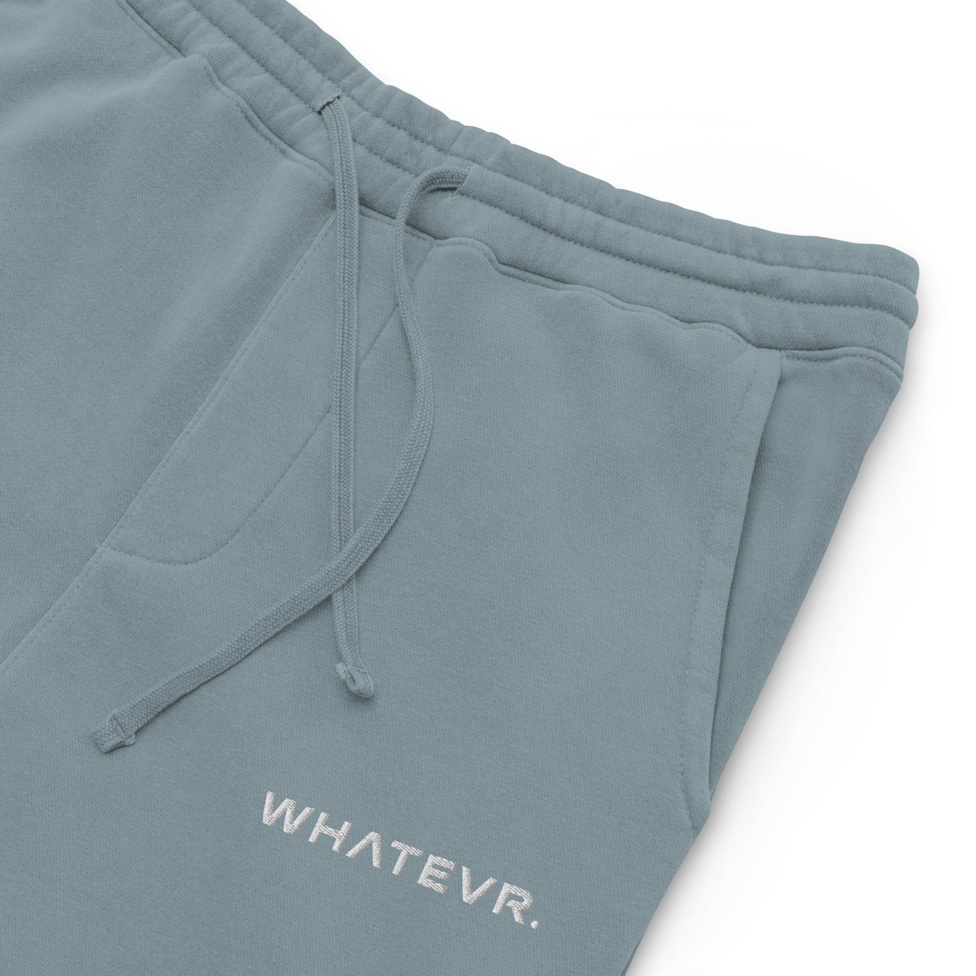 Women's essential relaxed sweatpants in light blue with embroidered detailing, front view.