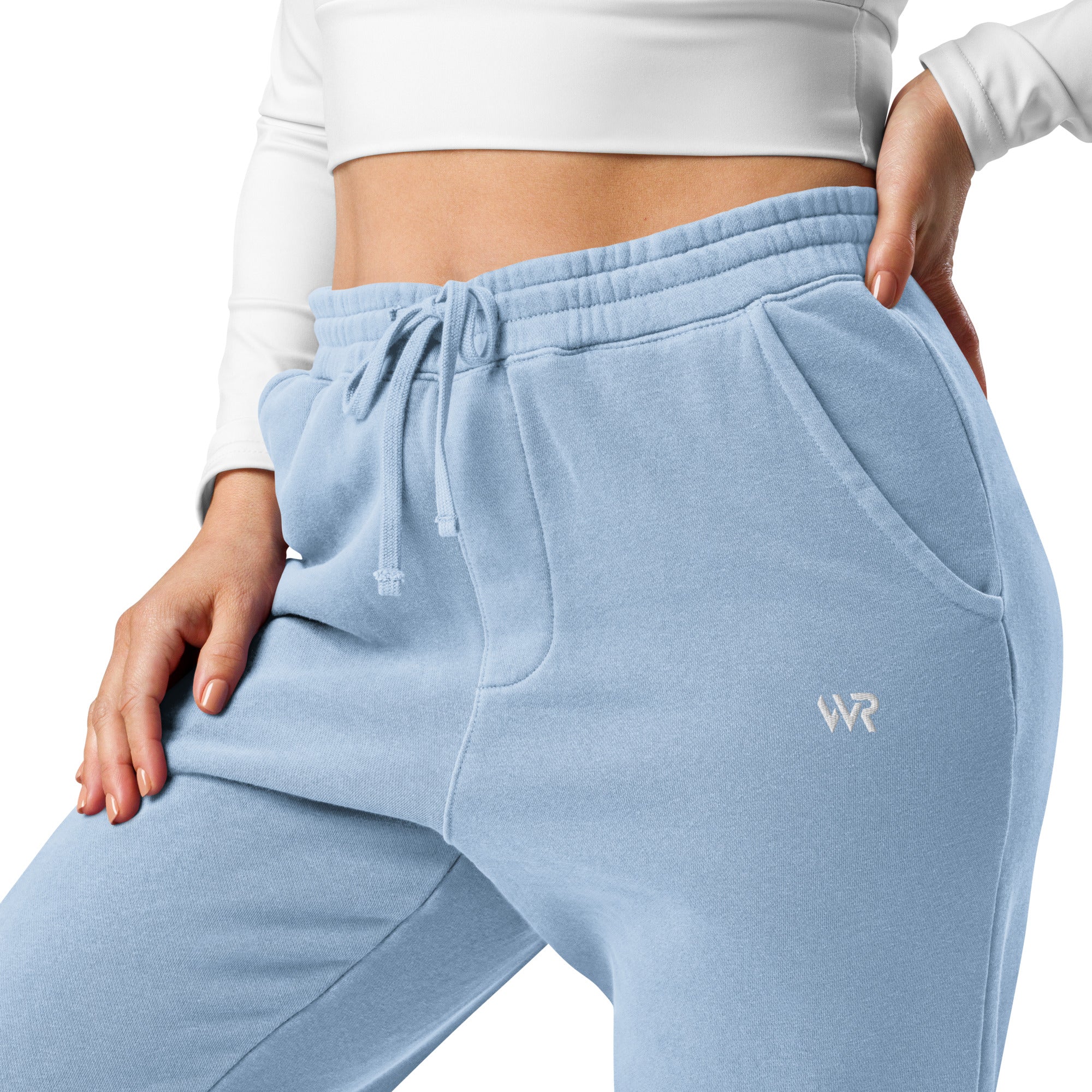 Women's essential relaxed sweatpants in light blue with embroidered detailing, front view.