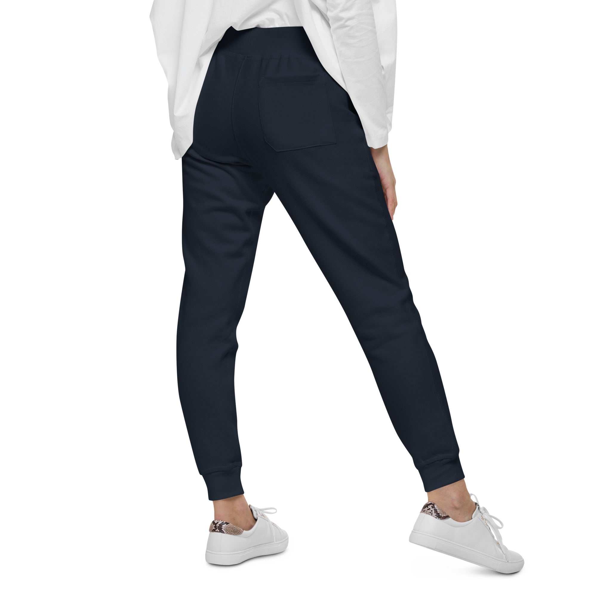 Women's essential slim fit sweatpants in dark blue, back view.