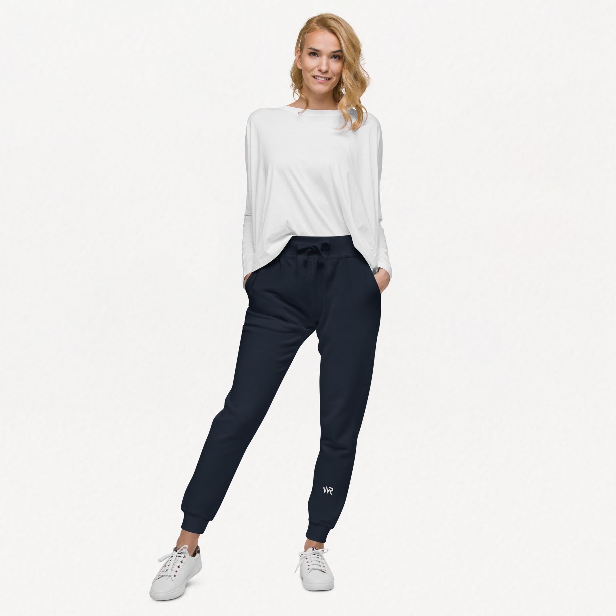 Women's essential slim fit sweatpants in dark blue, front view.