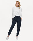 Women's essential slim fit sweatpants in dark blue, front view.
