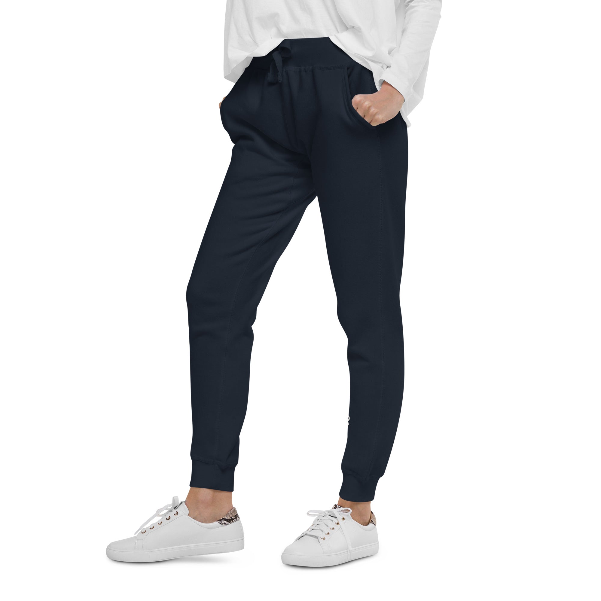 Women's essential slim fit sweatpants in dark blue, side view.