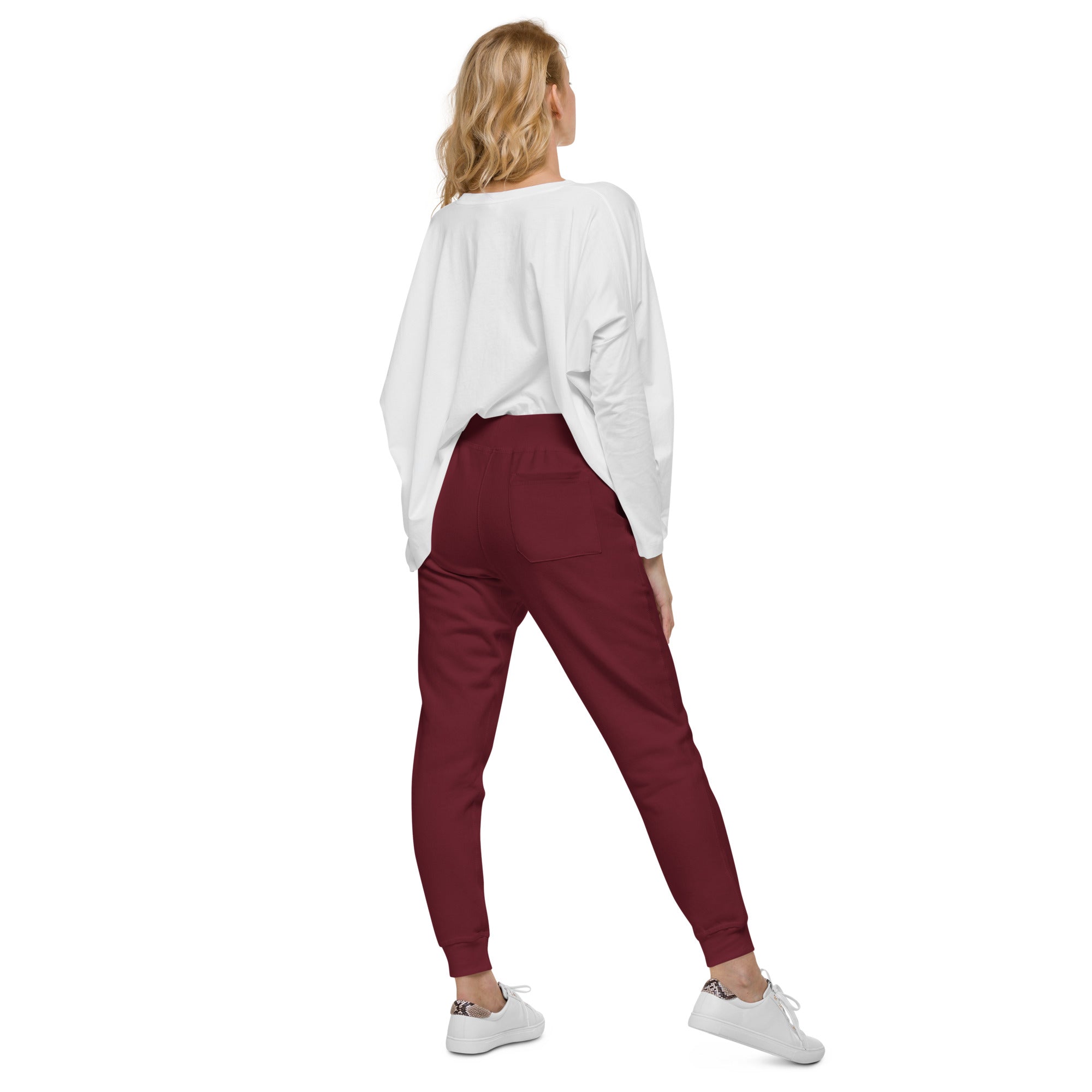 Women's essential slim fit sweatpants in maroon, back view.