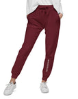 Women's essential slim fit sweatpants in maroon, front view.