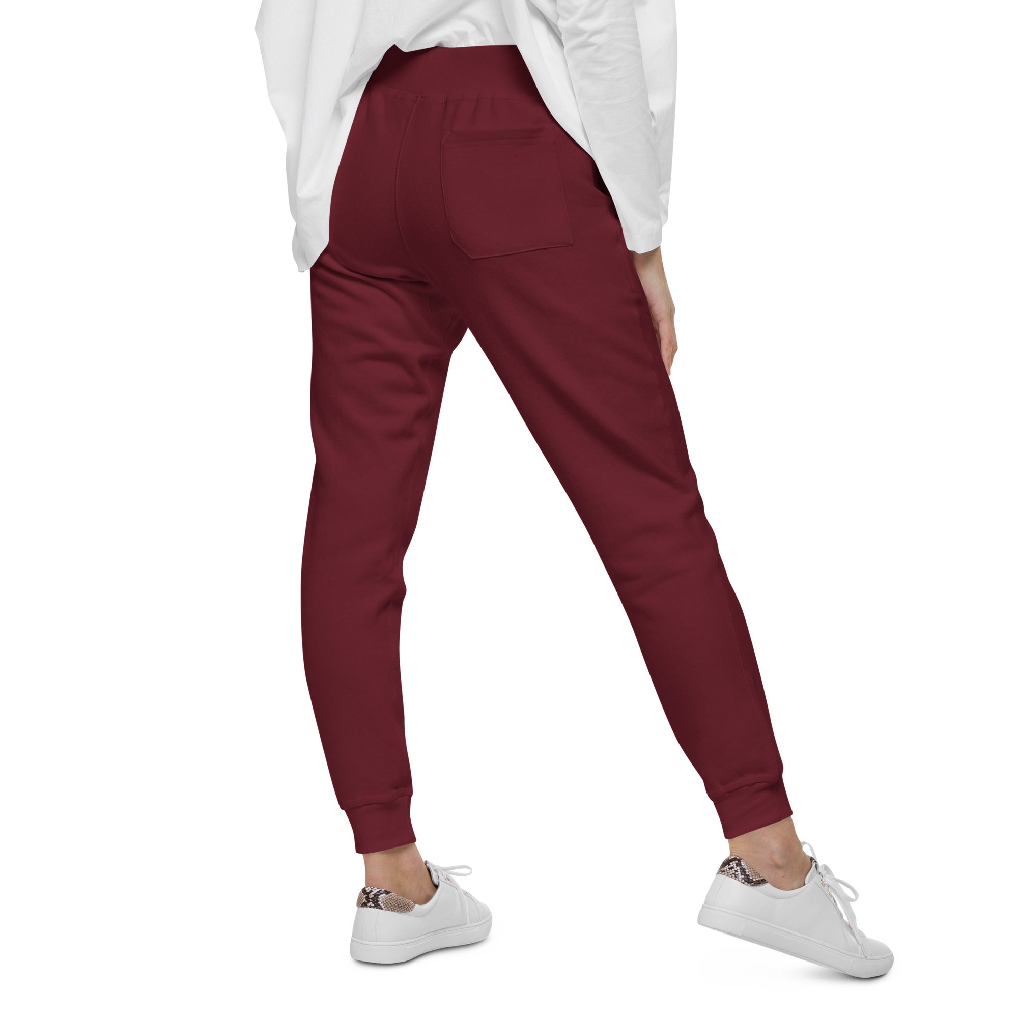Women's essential slim fit sweatpants in maroon, back view.