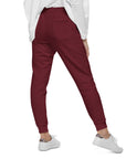 Women's essential slim fit sweatpants in maroon, back view.